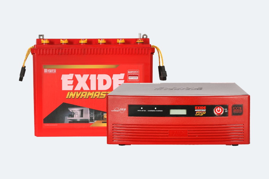 A tall tubular inverter battery standing beside a matching home inverter unit.