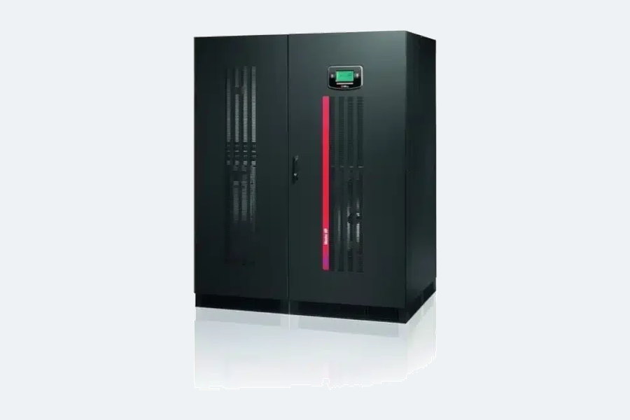 A large floor-standing three-phase online UPS cabinet with twin louvred doors and a front-mounted control and status panel.