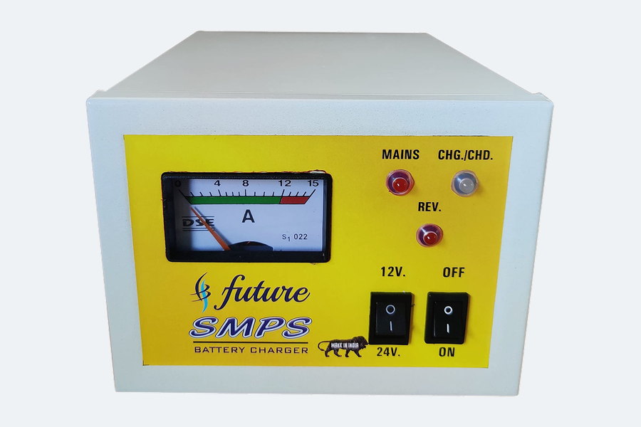 An SMPS battery charger in a cased enclosure with an output ammeter, mains and charging indicator lamps, and a 12/24 volt selector.